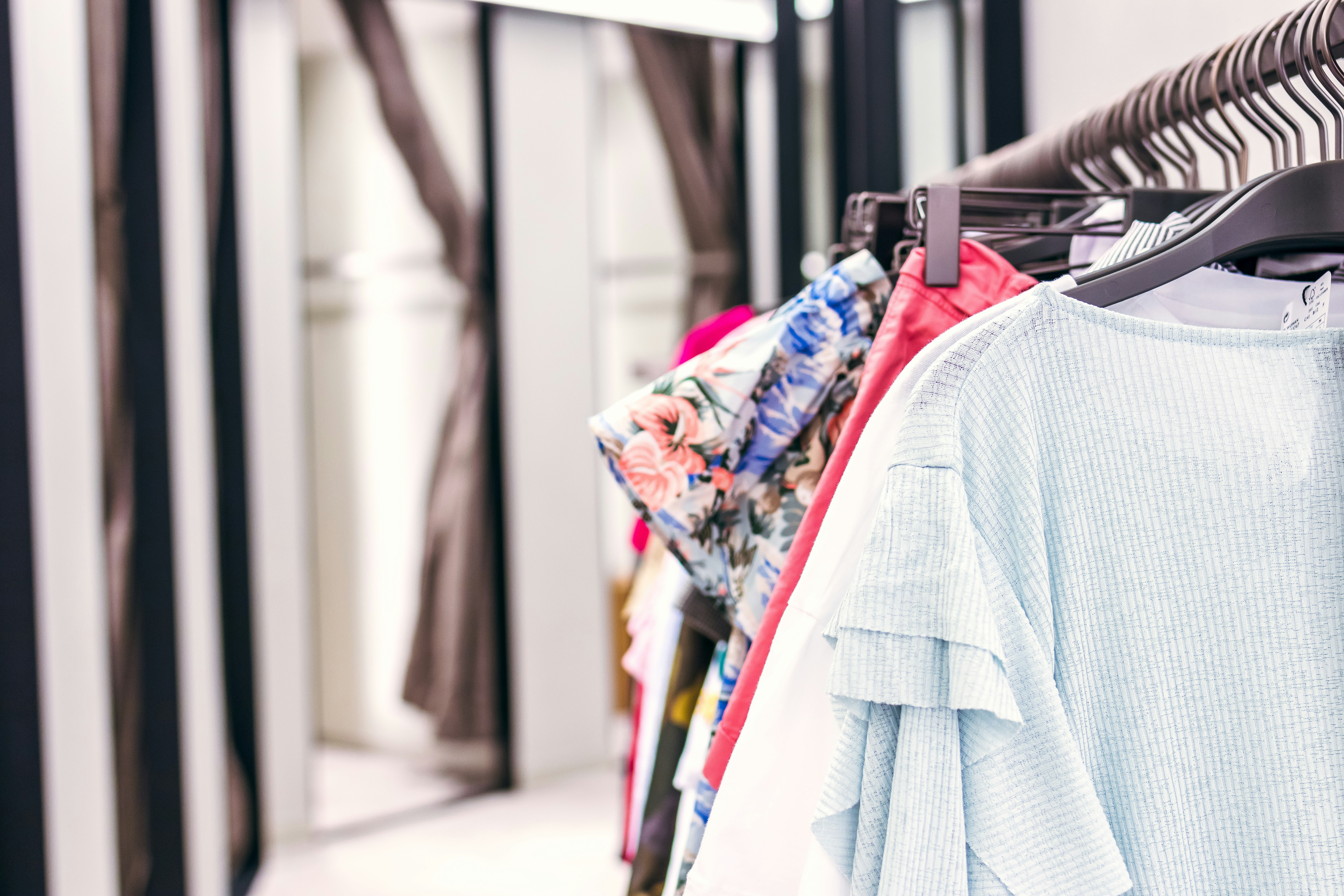 assorted-colored clothes on hangers